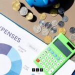 Budget papers and a calculator for someone trying to figure out how much to file chapter 7